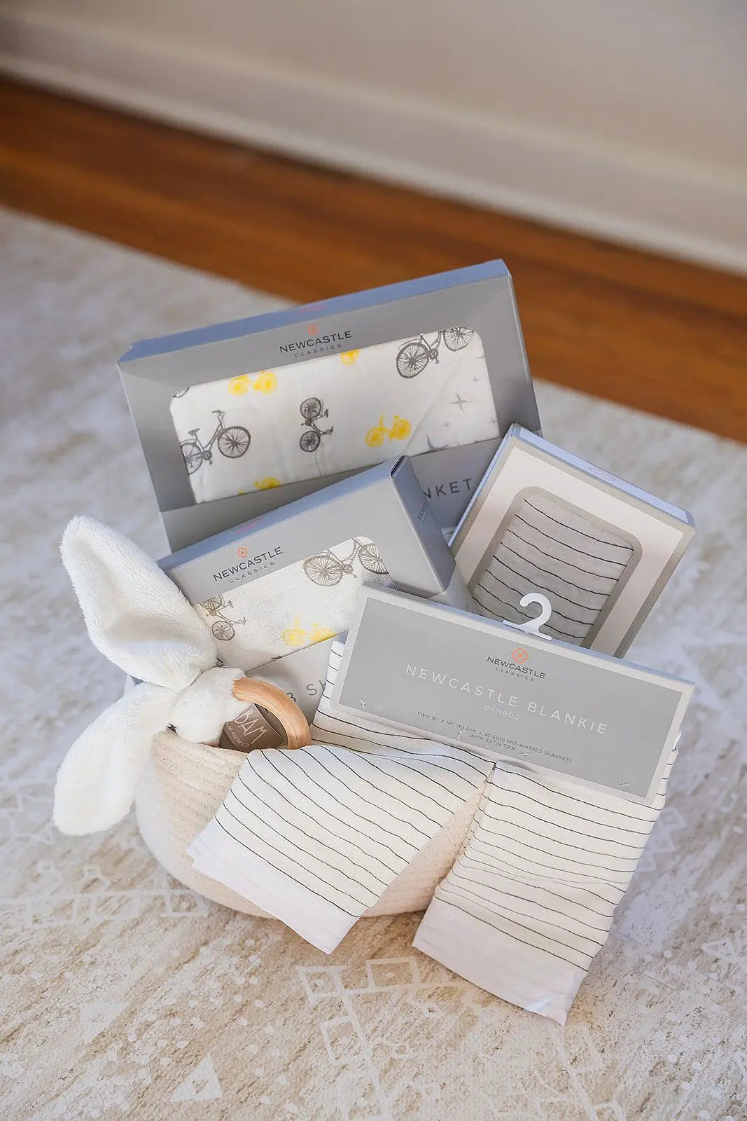Welcome Baby Gender Neutral Gift Basket with Bamboo Blanket Swaddle Crib Sheet and Wooden Teether Newcastle Classics