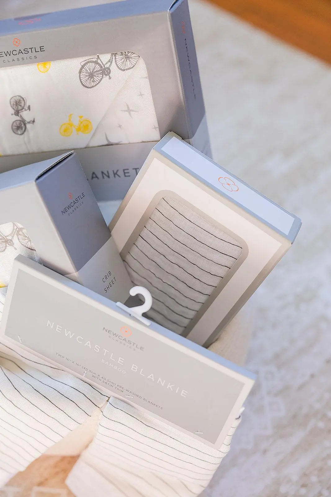 Welcome Baby Gender Neutral Gift Basket with Bamboo Blanket Swaddle Crib Sheet and Wooden Teether Newcastle Classics