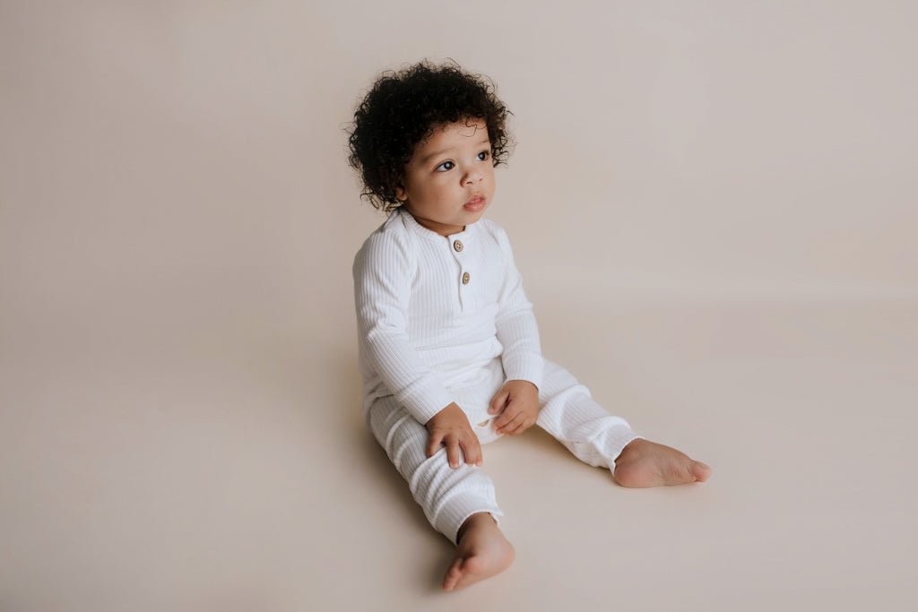 Three Little Tots White Baby Ribbed Playsuit with pockets - 