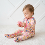 Baby footie pajamas in the Willow print with a full-length two-way zipper and covered feet