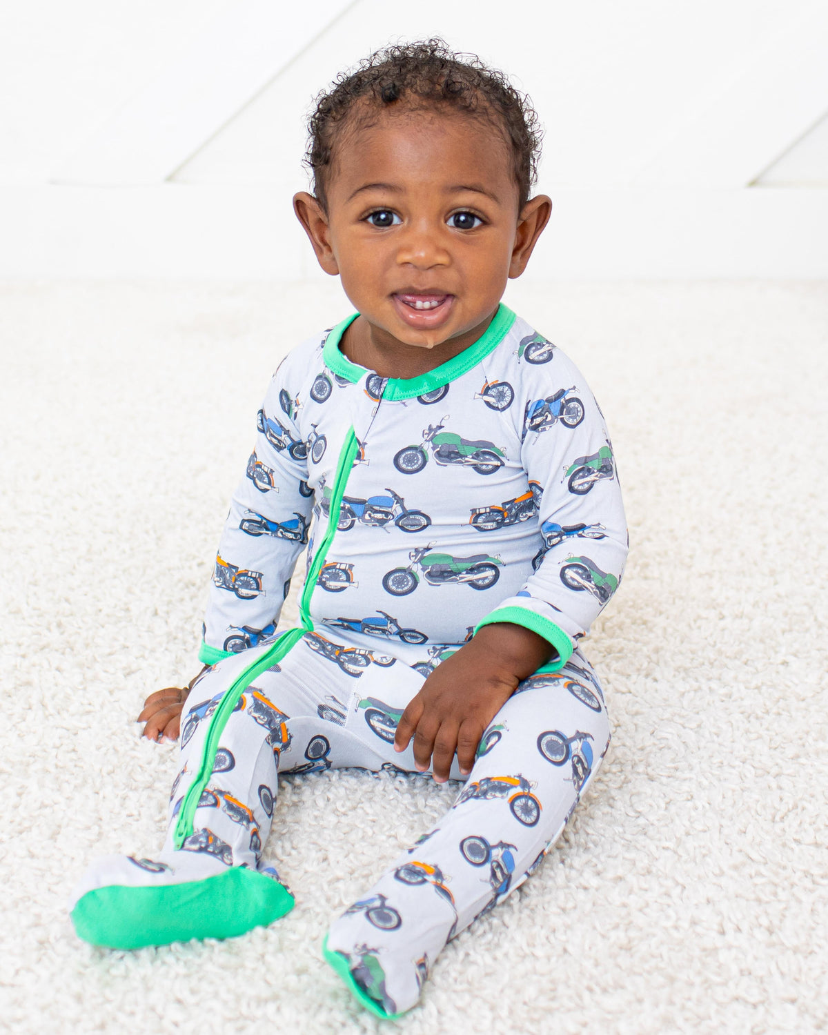 Baby footie pajamas with Wind Warriors print and two-way zipper down the front