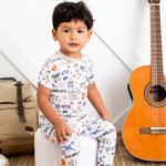 World Traveler short sleeve pajama set with travel-themed print, top and matching pants shown on a toddler