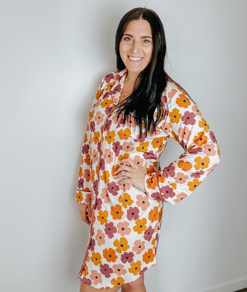 Women's button up dress in bamboo with a vibrant floral print and front pockets