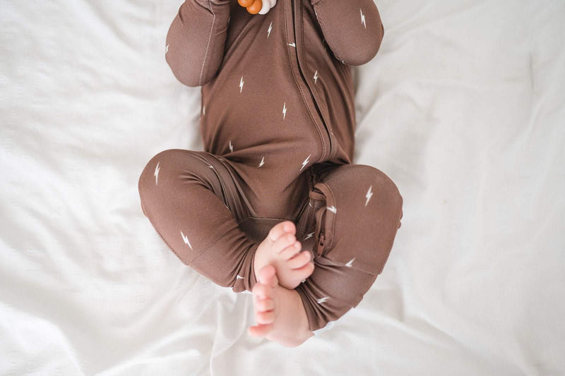 Brown lightning design zipper romper with fold-over feet and hands, featuring a 2-way zipper for babies.
