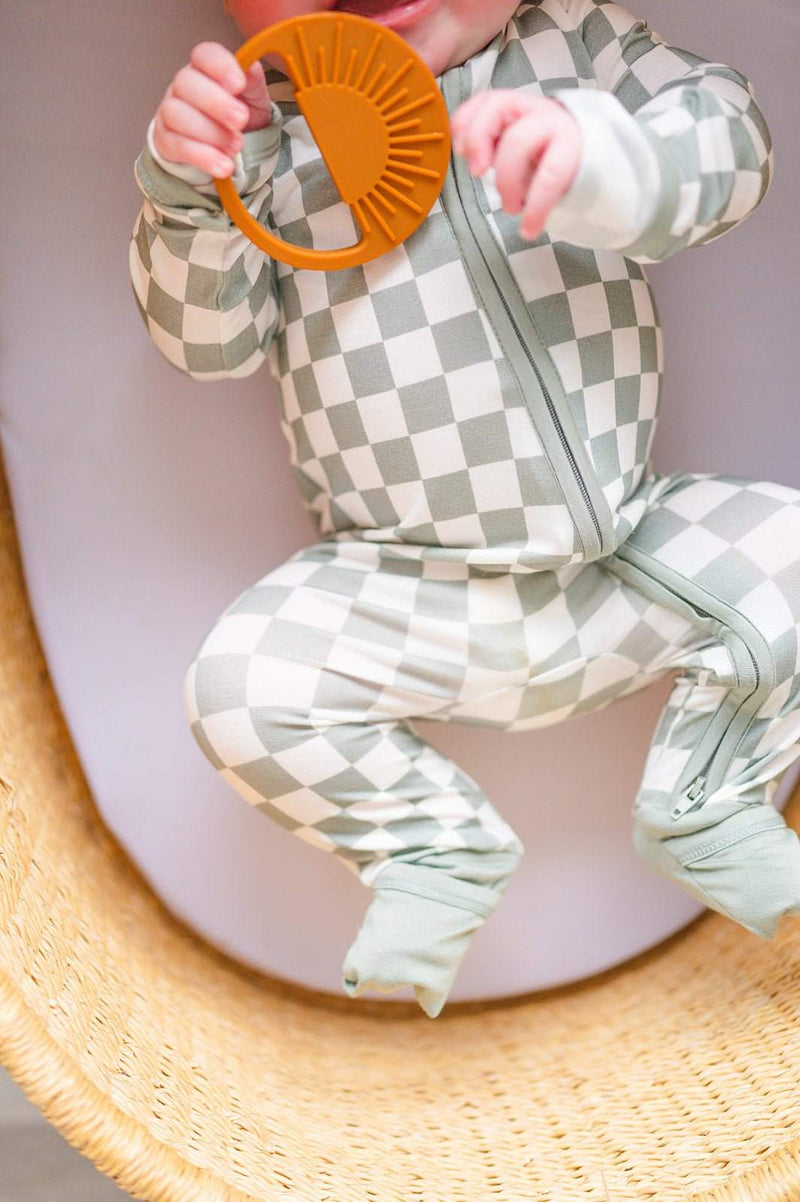 Jade checker zipper romper for babies, featuring a 2-way zipper and fold-over cuffs, made from soft bamboo viscose.